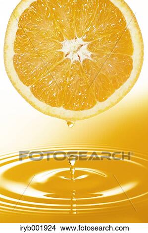 Half orange and juice View Large Photo Image Picture - Half orange and juice. Fotosearch