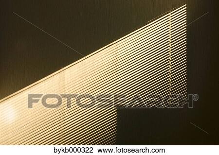 Stock Image - Light and shade on wall. Fotosearch