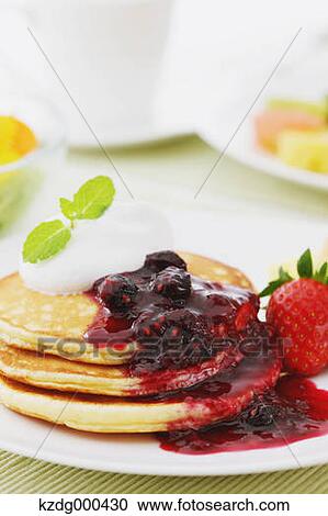 Stock Image - Pancakes and fruits. Fotosearch