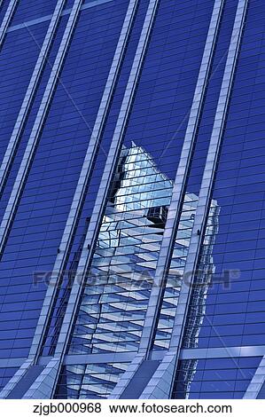 Stock Photo - Reflections on building windows. Fotosearch