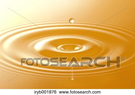 Ripples in orange juice View Large Photo Image Stock Photograph - Ripples in orange juice. Fotosearch