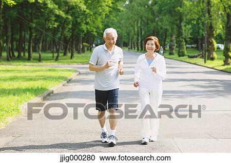 Senior couple jogging in a park View Large Photo Image Stock Image - Senior couple jogging in a park. Fotosearch