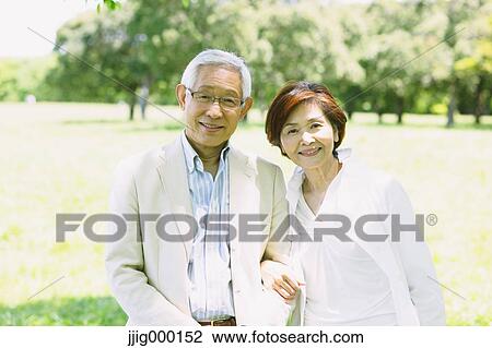 Senior couple smiling at camera View Large Photo Image Stock Image - Senior couple smiling at camera. Fotosearch