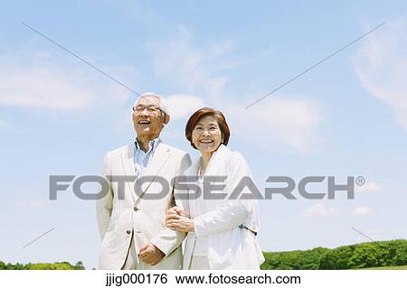 Senior couple smiling at camera View Large Photo Image Stock Photograph - Senior couple smiling at camera. Fotosearch