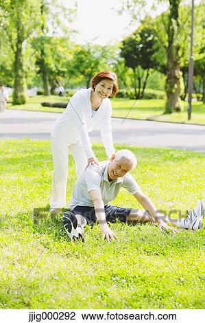Senior couple training in a park View Large Photo Image Stock Image - Senior couple training in a park. Fotosearch