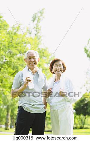 Senior couple with bottled water after training View Large Photo Image Stock Photography - Senior couple with bottled water after training. Fotosearch