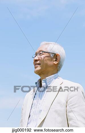 Senior man smiling away View Large Photo Image Stock Image - Senior man smiling away. Fotosearch