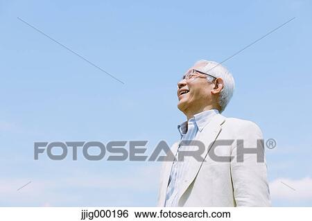 Senior man smiling away View Large Photo Image Stock Photograph - Senior man smiling away. Fotosearch