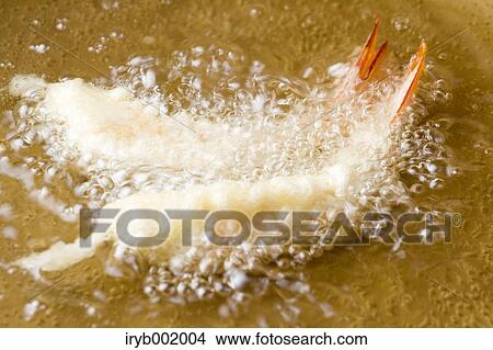 Shrimps being fried View Large Photo Image Picture - Shrimps being fried. Fotosearch