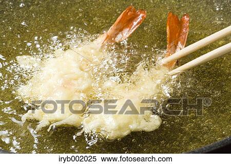 Shrimps being fried View Large Photo Image Stock Photography - Shrimps being fried. Fotosearch