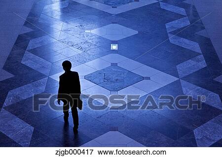 Stock Photo - Silhouette of businessman walking. Fotosearch
