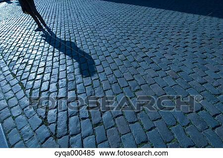 Silhouette on cobblestone View Large Photo Image Stock Photography - Silhouette on cobblestone. Fotosearch