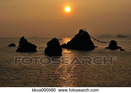 Stock Image - Sunrise at Meoto Iwa, Mie Prefecture. Fotosearch