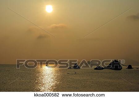 Stock Image - Sunrise at Meoto Iwa, Mie Prefecture. Fotosearch