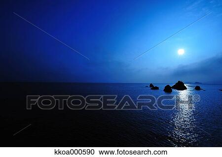 Stock Image - Sunrise at Meoto Iwa, Mie Prefecture. Fotosearch