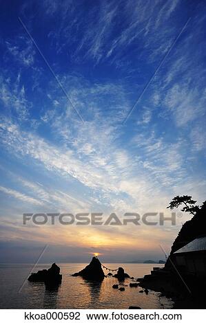 Stock Image - Sunrise at Meoto Iwa, Mie Prefecture. Fotosearch