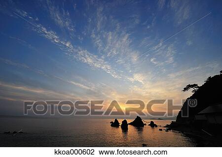 Stock Image - Sunrise at Meoto Iwa, Mie Prefecture. Fotosearch