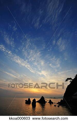 Stock Image - Sunrise at Meoto Iwa, Mie Prefecture. Fotosearch
