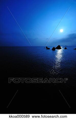 Stock Photo - Sunrise at Meoto Iwa, Mie Prefecture. Fotosearch