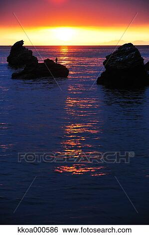Stock Photograph - Sunrise at Meoto Iwa, Mie Prefecture. Fotosearch