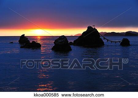 Stock Photography - Sunrise at Meoto Iwa, Mie Prefecture. Fotosearch