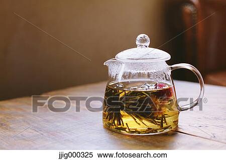 Teapot on wooden table View Large Photo Image Stock Photography - Teapot on wooden table. Fotosearch