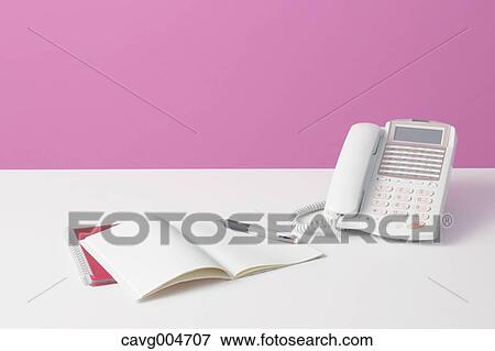 Telephone and agenda on desk View Large Photo Image Stock Photo - Telephone and agenda on desk. Fotosearch