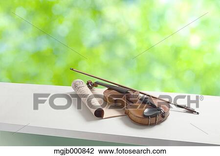 Violin and music sheets by the window View Large Photo Image Stock Image - Violin and music sheets by the window. Fotosearch