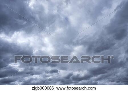 Stock Photograph - Watery clouds. Fotosearch