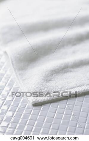White towel on tiled floor View Large Photo Image Stock Image - White towel on tiled floor. Fotosearch