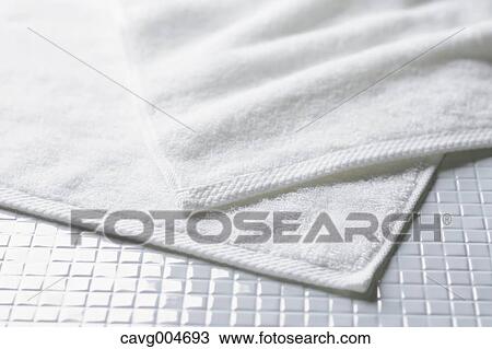 White towels on tiled floor View Large Photo Image Stock Image - White towels on tiled floor. Fotosearch