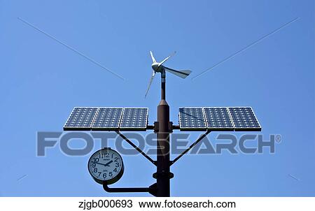Stock Image - Wind-solar hybrid power generation clock. Fotosearch