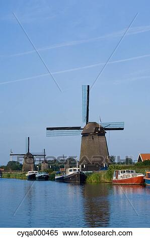 Windmill and canal, Netherlands View Large Photo Image Stock Photography - Windmill and canal, Netherlands. Fotosearch