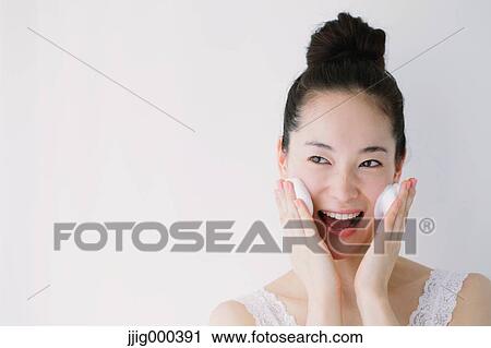 Young woman putting face-wash foam View Large Photo Image Stock Image - Young woman putting face-wash foam. Fotosearch