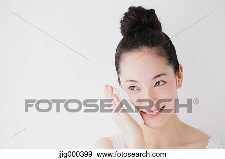 Young woman putting face-wash foam View Large Photo Image Stock Photo - Young woman putting face-wash foam. Fotosearch