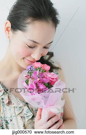 Young woman wearing one piece with a bouquet View Large Photo Image Stock Image - Young woman wearing one piece with a bouquet. Fotosearch