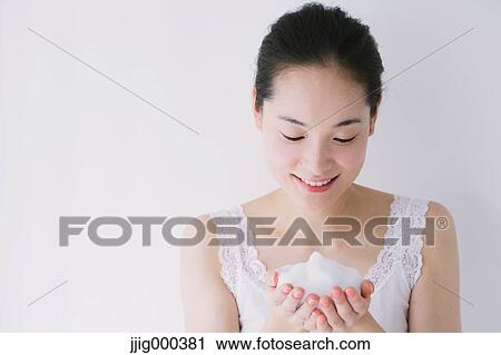 Young woman with face-wash foam View Large Photo Image Stock Image - Young woman with face-wash foam. Fotosearch