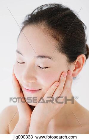 Young woman with no make-up smiling with closed eyes View Large Photo Image Stock Image - Young woman with no make-up smiling with closed eyes. Fotosearch