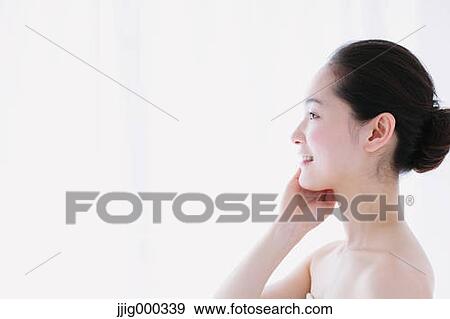Stock Photo - Young woman with no make-up smiling. Fotosearch