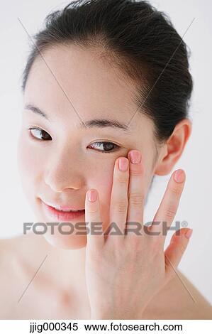 Stock Photography - Young woman with no make-up. Fotosearch