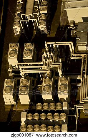 Stock Photo - Air conditioning system on building rooftop. Fotosearch