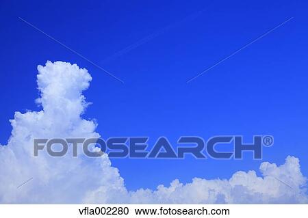 Blue sky with clouds View Large Photo Image Stock Image - Blue sky with clouds. Fotosearch