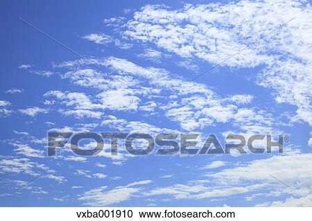 Blue sky with clouds View Large Photo Image Stock Image - Blue sky with clouds. Fotosearch