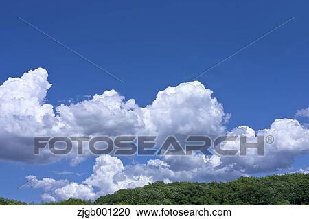 Blue sky with clouds View Large Photo Image Stock Image - Blue sky with clouds. Fotosearch