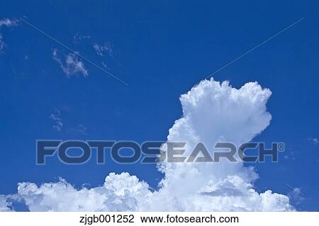 Stock Image - Blue sky with clouds. Fotosearch