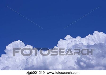Blue sky with clouds View Large Photo Image Stock Photo - Blue sky with clouds. Fotosearch