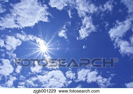 Blue sky with clouds View Large Photo Image Stock Photo - Blue sky with clouds. Fotosearch