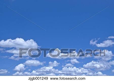 Blue sky with clouds View Large Photo Image Stock Photo - Blue sky with clouds. Fotosearch