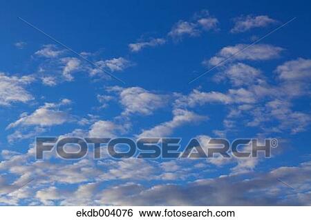 Blue sky with clouds View Large Photo Image Stock Photograph - Blue sky with clouds. Fotosearch