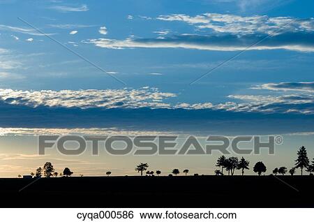 Stock Photograph - Countryside at sunset. Fotosearch